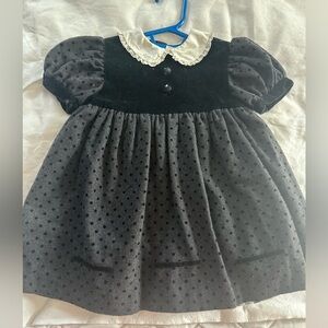 Black with velvet and white collar baby dress. Unsure of size but I think 12mo